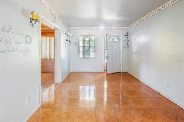 entryway with light tile patterned flooring