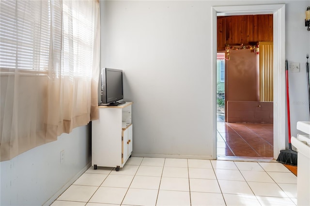 bedroom with light tile patterned flooring