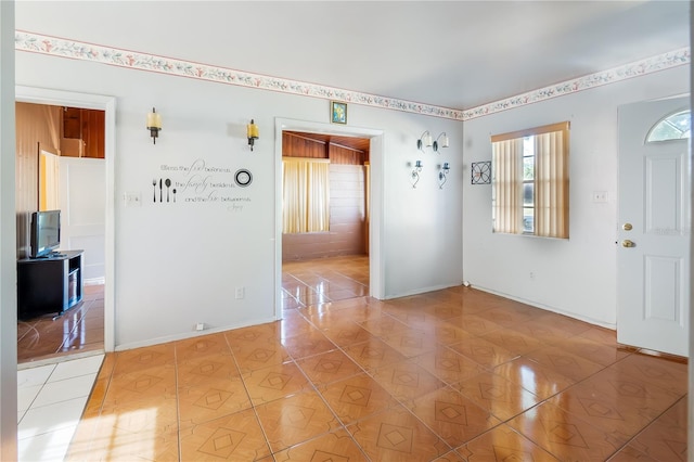 spare room featuring light tile patterned floors