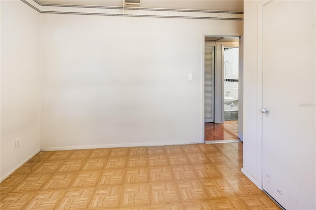 empty room with light parquet flooring