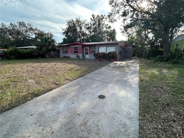 ranch-style house with a front lawn