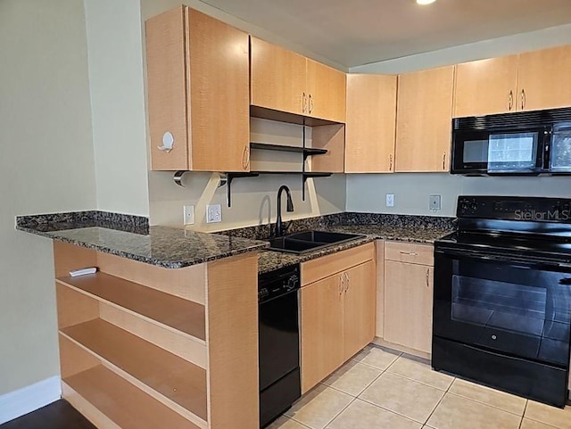 kitchen featuring light brown cabinets, black appliances, dark stone counters, sink, and light tile floors