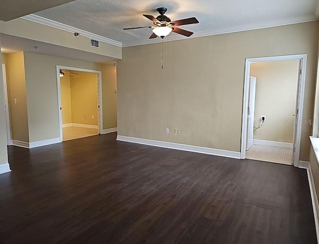 spare room with a textured ceiling, hardwood / wood-style floors, ceiling fan, and crown molding