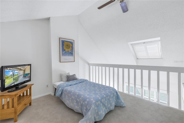 bedroom featuring ceiling fan, light colored carpet, and lofted ceiling