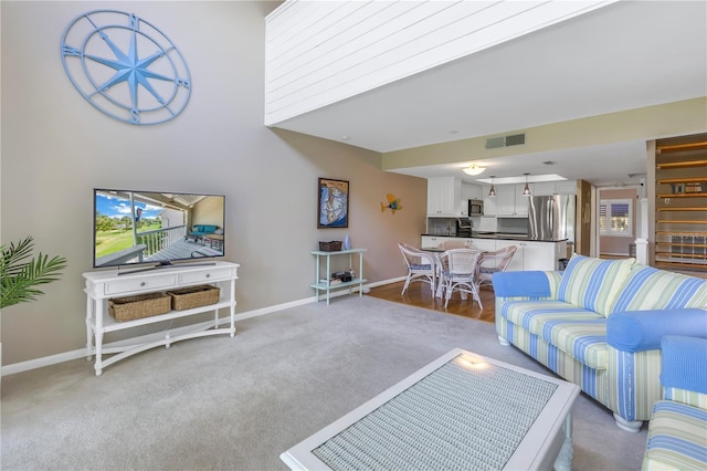 living room featuring light carpet