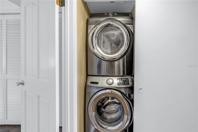 laundry area with stacked washer / drying machine