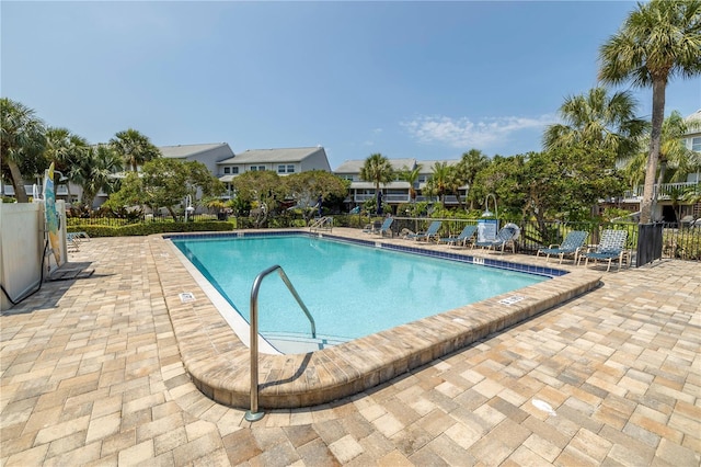 view of swimming pool featuring a patio area