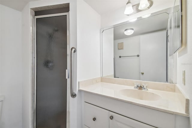 bathroom featuring an enclosed shower, toilet, and vanity