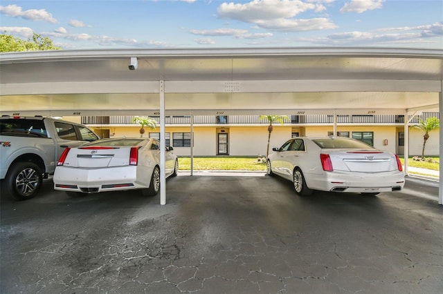 view of vehicle parking featuring a carport