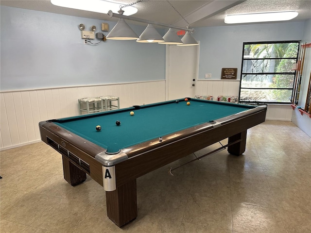 game room with a textured ceiling, billiards, and tile floors