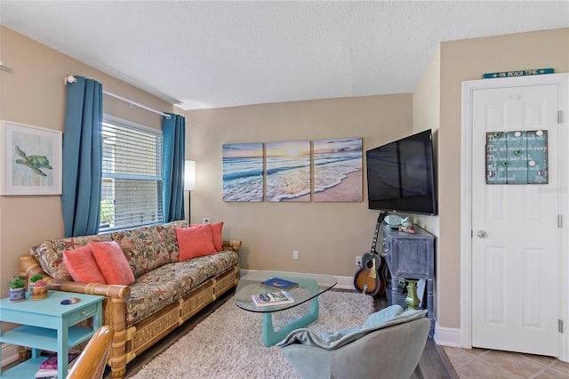 tiled living room with a textured ceiling