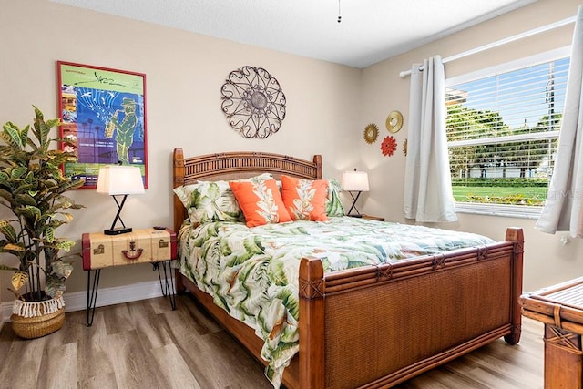 bedroom with hardwood / wood-style floors