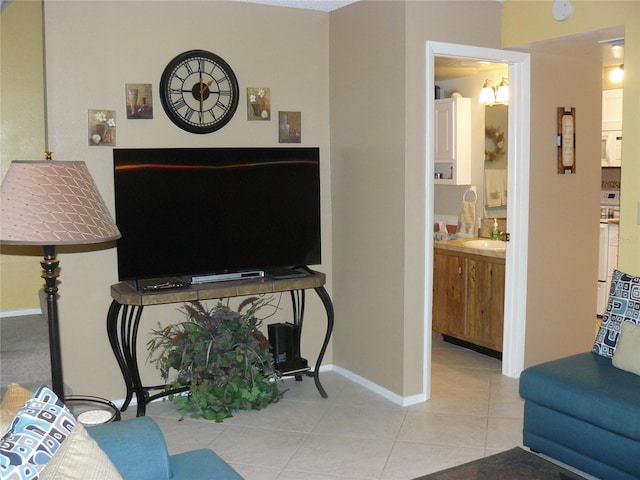 tiled living room featuring sink