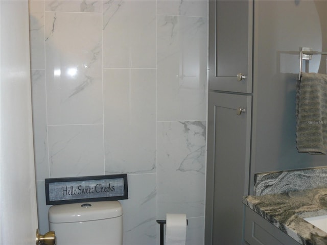 bathroom with vanity and toilet