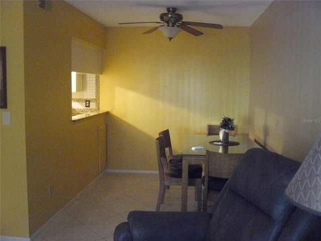 dining room featuring light tile patterned flooring and ceiling fan