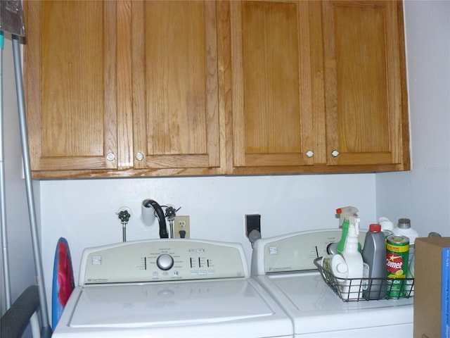 laundry area featuring cabinets and washer and dryer