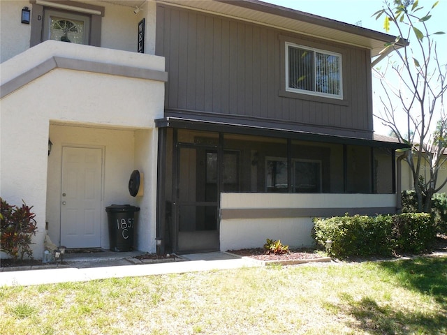 view of front of house with a sunroom