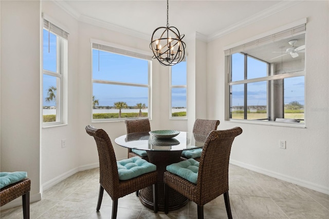 dining space featuring crown molding, light tile patterned floors, baseboards, and a chandelier