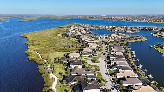 aerial view featuring a residential view and a water view