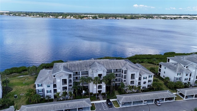 birds eye view of property featuring a water view