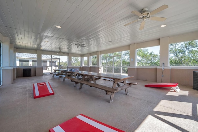 interior space with ceiling fan