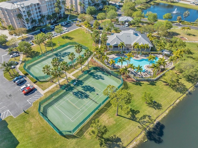 birds eye view of property with a water view