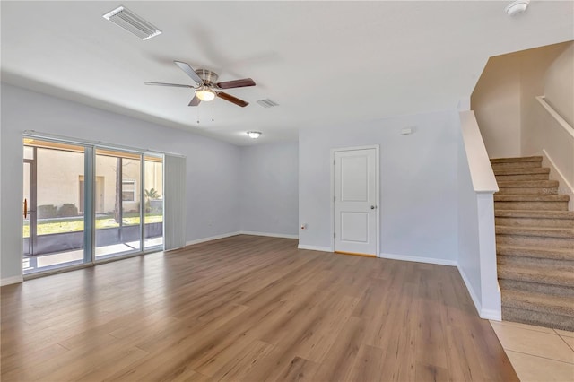 empty room featuring wood-type flooring and ceiling fan