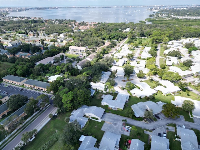 birds eye view of property featuring a water view and a residential view