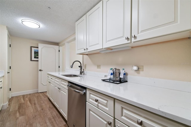 kitchen featuring light hardwood / wood-style floors, dishwasher, a textured ceiling, white cabinets, and sink