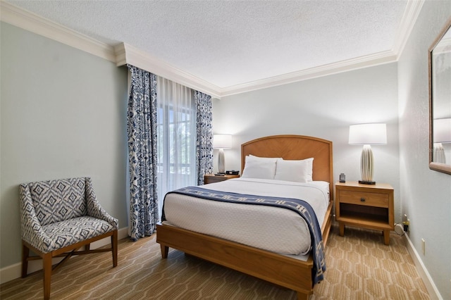 bedroom featuring ornamental molding and a textured ceiling