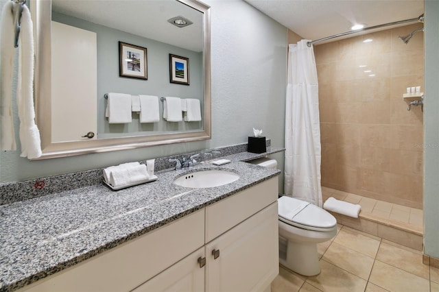 bathroom with a shower with shower curtain, large vanity, toilet, and tile flooring