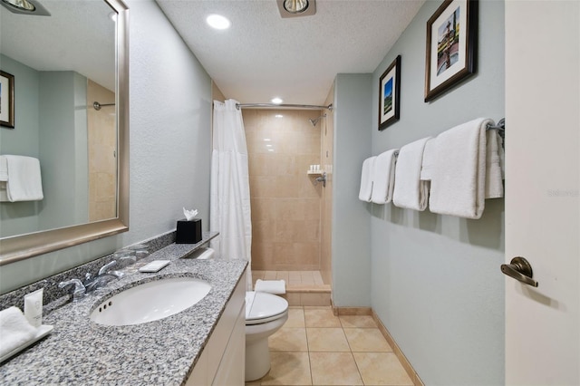 bathroom featuring walk in shower, toilet, tile flooring, a textured ceiling, and vanity