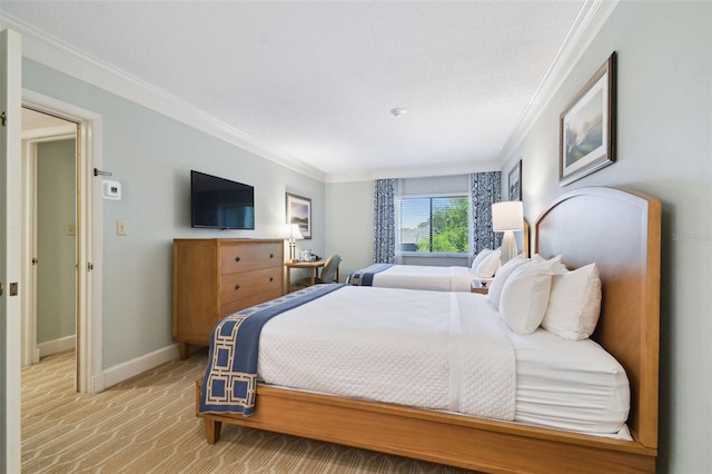 bedroom with light carpet and crown molding