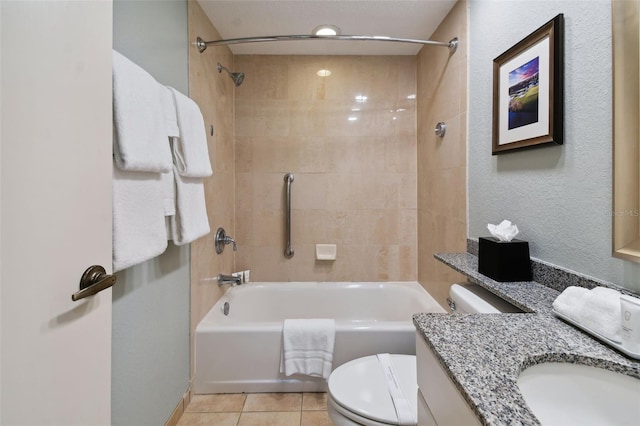 full bathroom with vanity, toilet, tiled shower / bath, and tile flooring