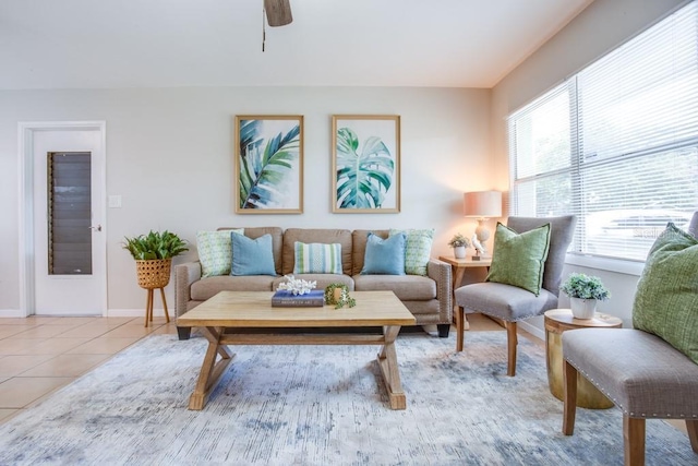 living room featuring ceiling fan and light tile patterned flooring