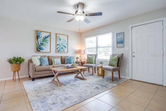 living room featuring ceiling fan and light tile patterned flooring