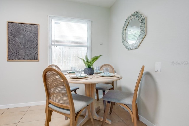 dining room with light tile patterned flooring