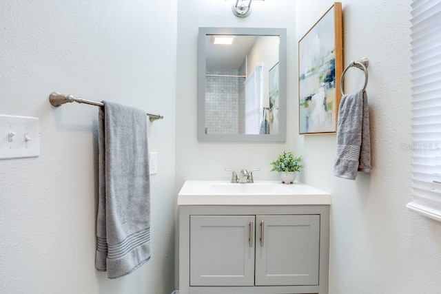 bathroom featuring vanity and walk in shower