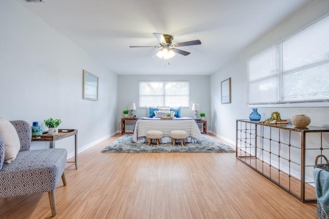 bedroom featuring light hardwood / wood-style flooring and ceiling fan