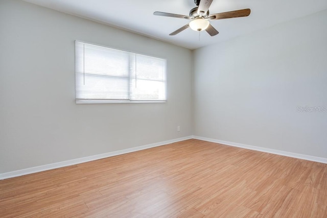 empty room with ceiling fan and light wood-type flooring