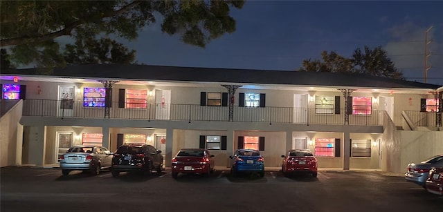 view of front of house with a balcony