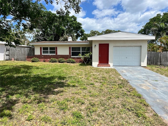 ranch-style house featuring a front lawn and a garage