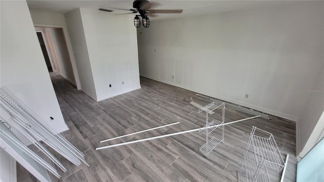 unfurnished room with wood-type flooring and ceiling fan