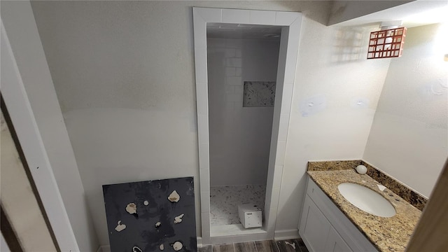 bathroom with vanity and wood-type flooring