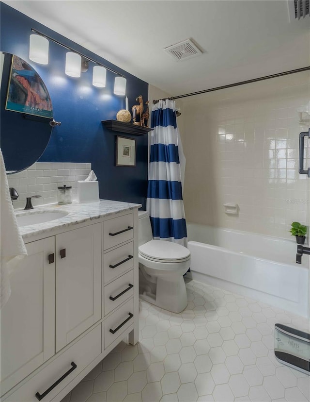 full bathroom featuring tile flooring, vanity, shower / bath combination with curtain, and toilet