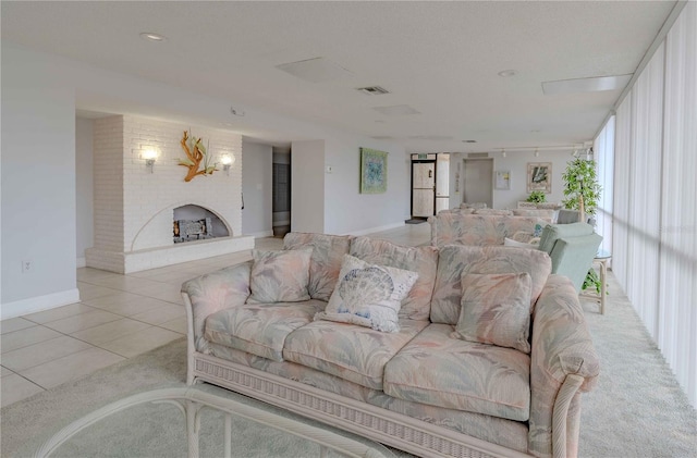 carpeted living room with brick wall and a barn door