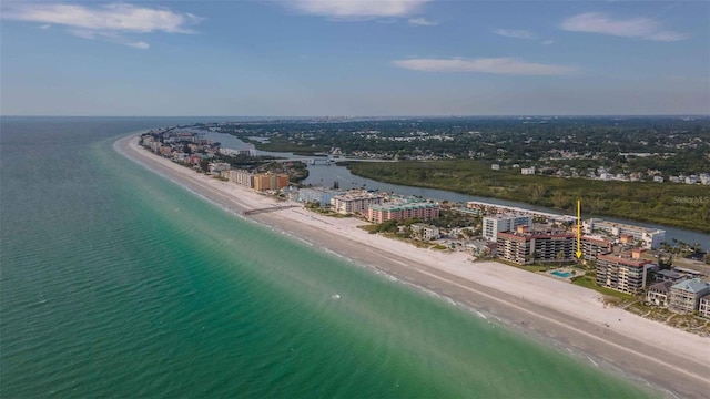 birds eye view of property featuring a beach view and a water view