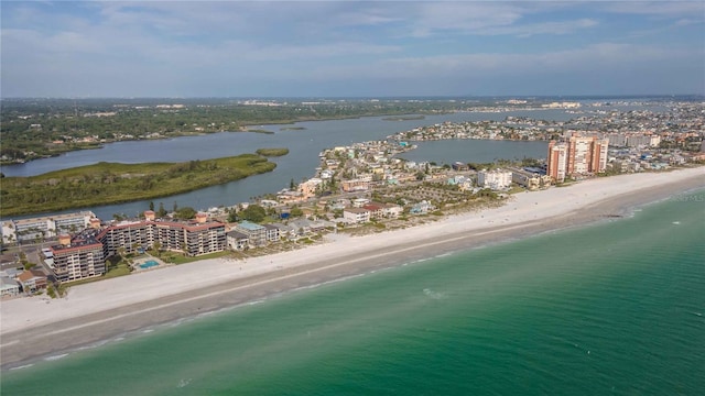 drone / aerial view with a beach view and a water view