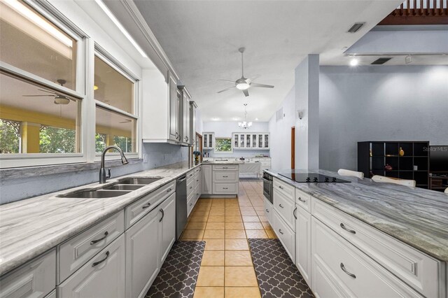 kitchen with ceiling fan, light tile floors, sink, white cabinetry, and stainless steel appliances