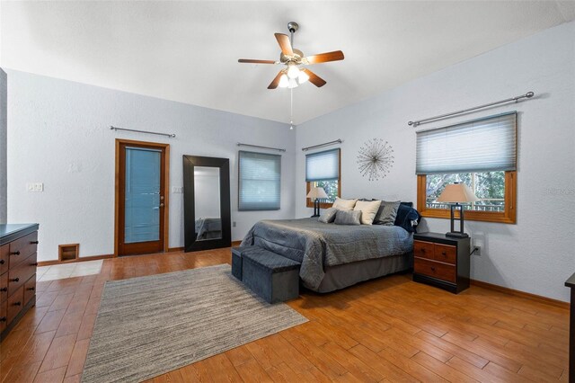 bedroom with hardwood / wood-style flooring and ceiling fan